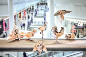 Thousands of pounds in origami money birds released across shopping centres nationwide